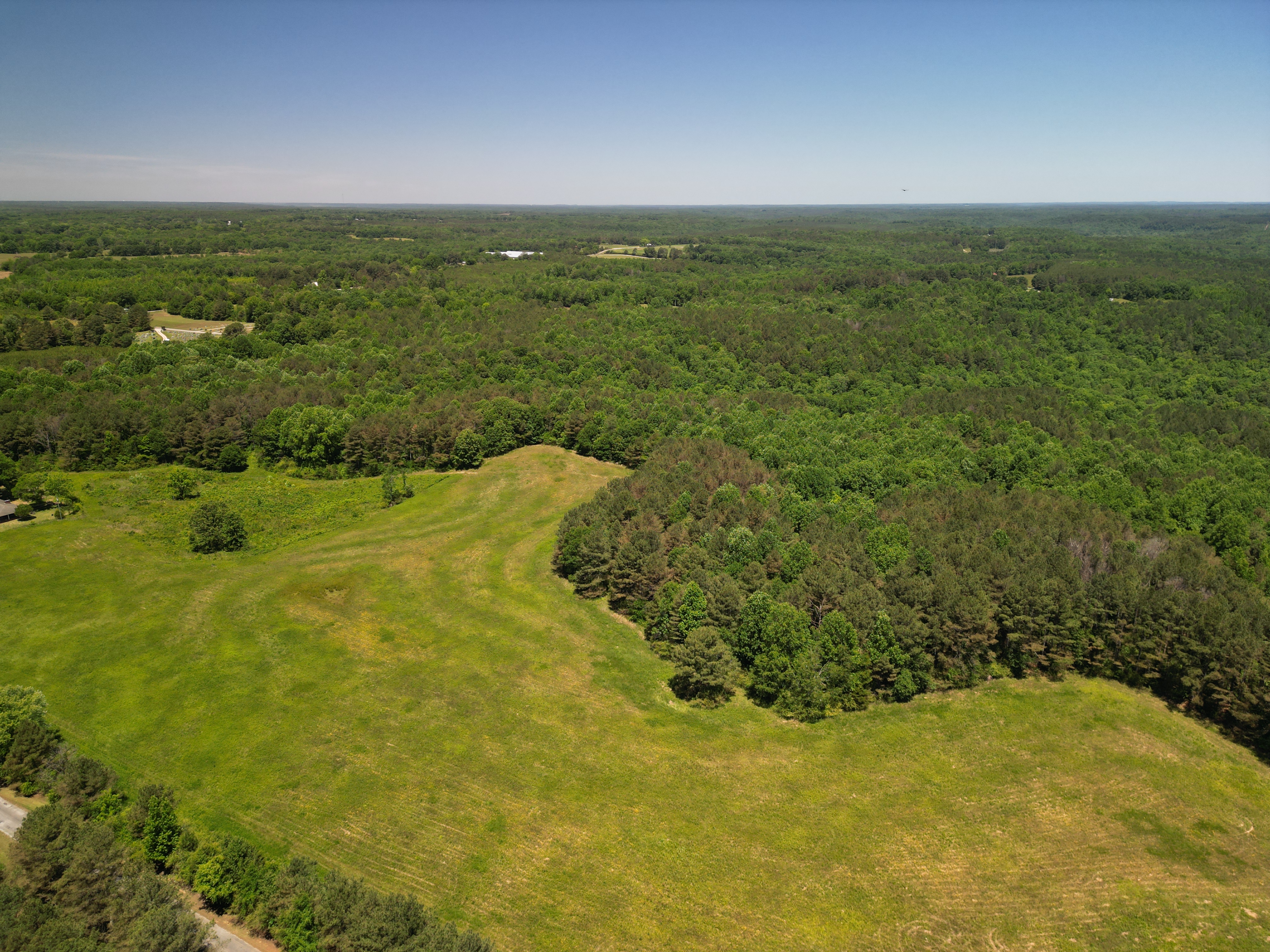 Aerial view of rural land and property features for listing or planning